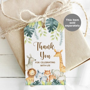 May include: A gift tag with a jungle theme, featuring a giraffe, zebra, lion, rhino, fox, and elephant. The tag says "Thank You for Celebrating with Us!" and is tied to a wrapped gift with twine.
