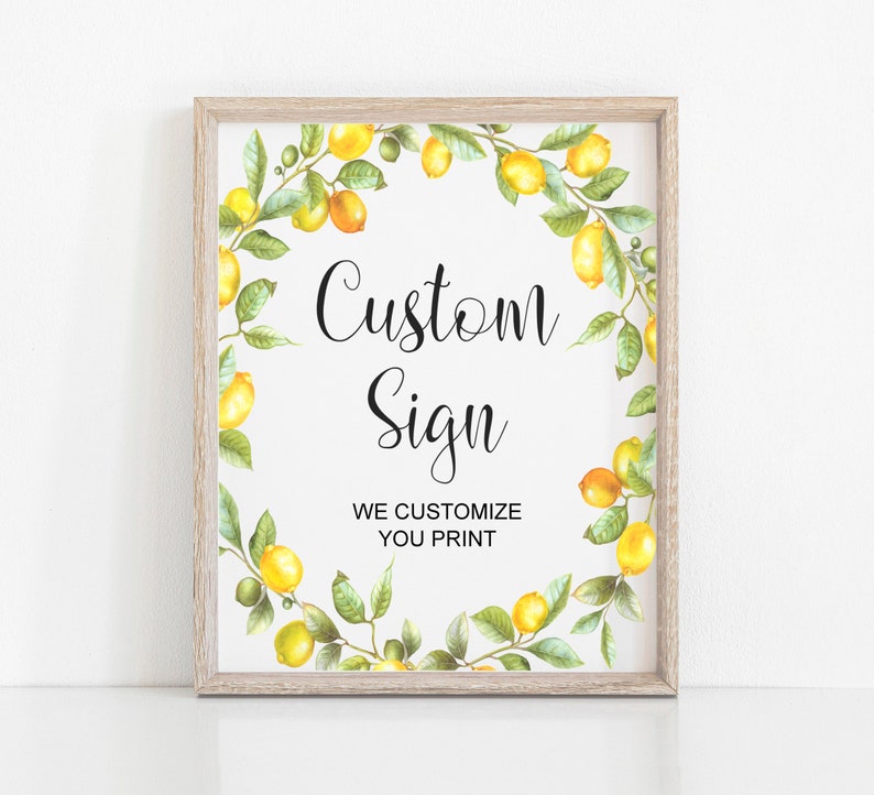May include: A printable sign with a lemon wreath border. The sign says "Custom Sign" and "We Customize You Print".