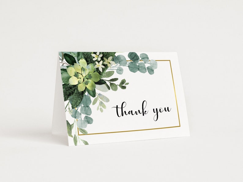 May include: A white thank you card with a gold frame and a watercolor illustration of green succulents and eucalyptus leaves. The text "thank you" is written in black cursive.