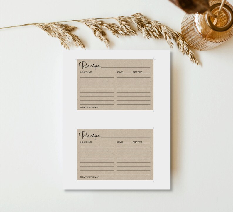 May include: Two brown recipe cards with a handwritten "Recipe" title, lines for ingredients, serves, and prep time, and the text "From the Kitchen of" at the bottom.
