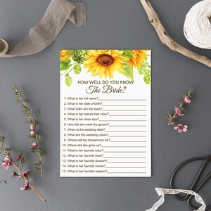 May include: A printable bridal shower game with a sunflower design. The game asks guests to answer questions about the bride, such as her full name, date of birth, favorite color, and favorite movie.