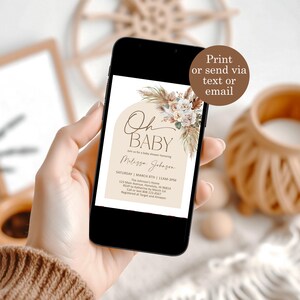 May include: A digital invitation for a baby shower with a beige background and a floral illustration. The text reads "Oh Baby" and "Join us for a baby shower honoring Melissa Johnson". The invitation includes the date, time, location, RSVP information, and gift registry details.