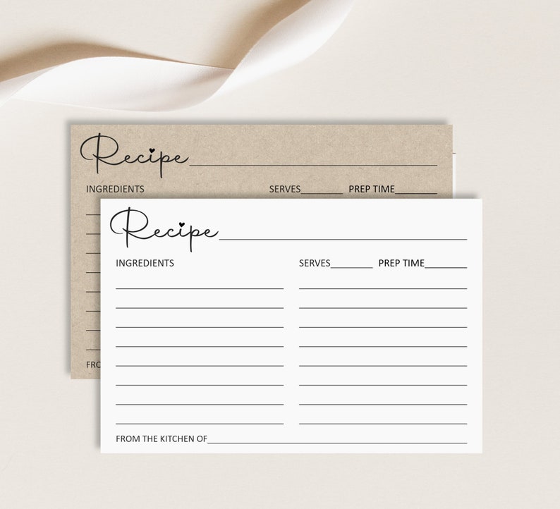 May include: A printable recipe card with the word 'Recipe' written in cursive at the top. The card has lines for writing the ingredients, serves, prep time, and from the kitchen of. The card is white with black lines and text.