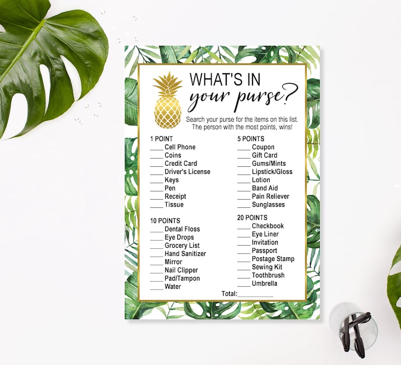 May include: A printable game card with a tropical theme. The card has a gold pineapple graphic and the text "WHAT'S IN YOUR PURSE?"  The card lists items to find in a purse and assigns points to each item.  The text "Search your purse for the items on this list. The person with the most points, wins!" is also included.
