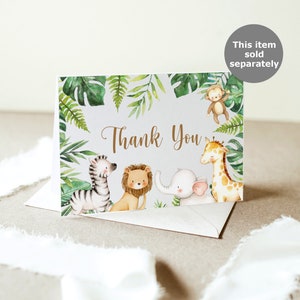 Pode incluir: Cart&atilde;o de agradecimento com tema de selva. O cart&atilde;o apresenta uma zebra, um le&atilde;o, um elefante, uma girafa e um macaco em estilo aquarela. O cart&atilde;o &eacute; cercado por folhas verdes.