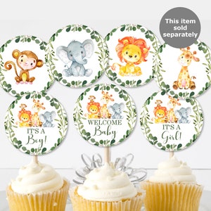 May include: Set of 7 jungle animal themed cupcake toppers. The toppers feature a lion, giraffe, elephant, monkey, and the text "Welcome Baby", "It's a Boy!" and "It's a Girl!"