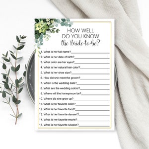 May include: A printable bridal shower game with a green floral design. The game asks guests to answer questions about the bride-to-be, such as her full name, date of birth, favorite color, and favorite season.