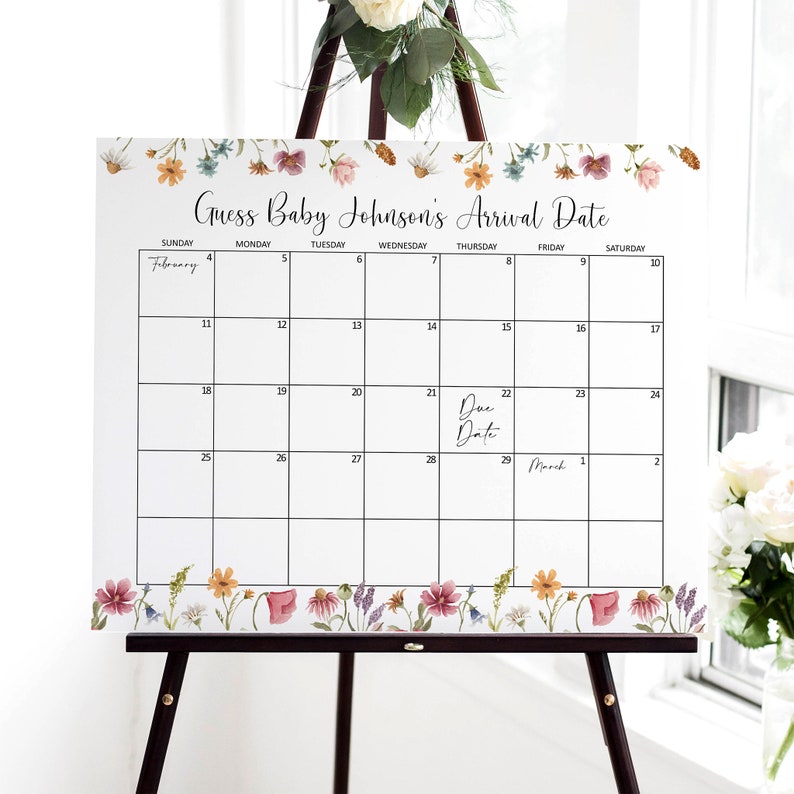 K&ouml;nnte beinhalten: Ein wei&szlig;er Kalender mit floralem Rand, beschriftet mit "Erraten Sie das Ankunftsdatum von Baby Johnson". Der Kalender ist f&uuml;r Februar und M&auml;rz, wobei der Geburtstermin auf den 22. Februar f&auml;llt.