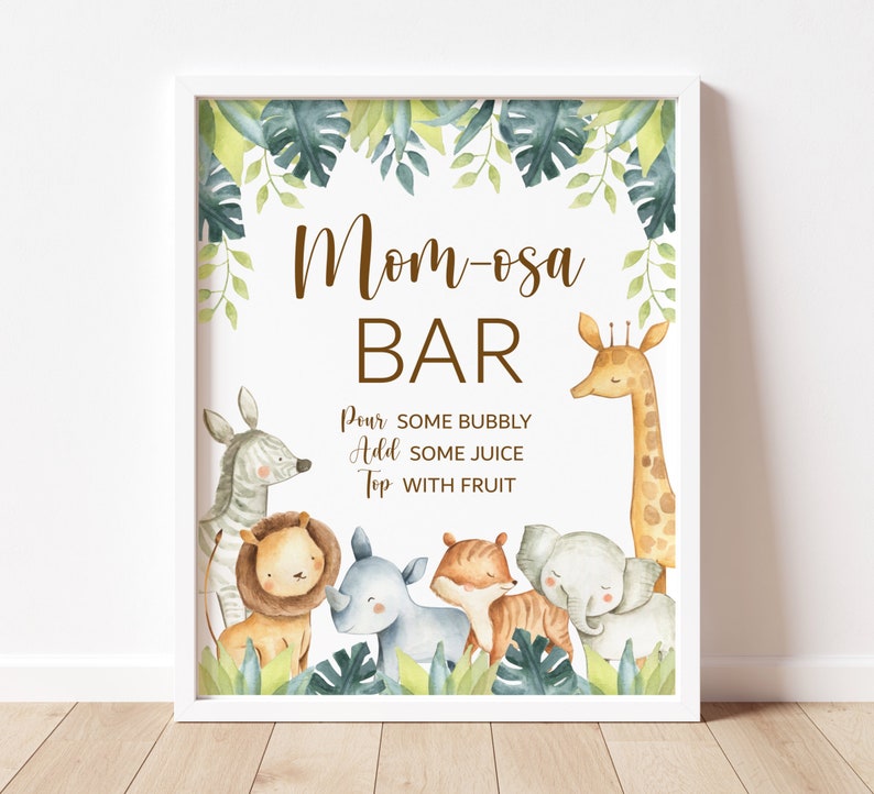 May include: A white sign with a brown border and the text 'Mom-osa Bar' in brown text. The sign is decorated with watercolor illustrations of jungle animals including a giraffe, zebra, lion, rhino, tiger, and elephant. The text below the bar title reads 'Pour some bubbly, Add some juice, Top with fruit.'