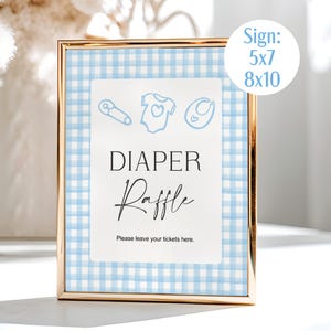 May include: A gold-framed sign with a blue and white gingham background. The sign reads "DIAPER Raffle" in elegant script, with baby-themed illustrations above. The sign is available in 5x7 and 8x10 inch sizes.