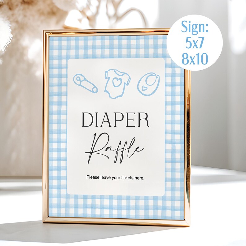 May include: A gold-framed sign with a blue and white gingham background. The sign reads "DIAPER Raffle" in elegant script, with baby-themed illustrations above. The sign is available in 5x7 and 8x10 inch sizes.