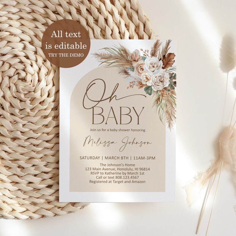 May include: A beige baby shower invitation with a watercolor illustration of pampas grass and white flowers. The text reads "Oh Baby" and includes details for the event, such as the date, time, location, and RSVP information.