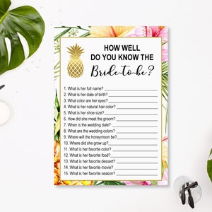 May include: A printable bridal shower game with a tropical theme. The game asks guests to answer questions about the bride-to-be, such as her full name, date of birth, favorite color, and favorite season. The game features a pineapple graphic and floral accents.
