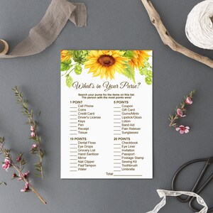 May include: A printable game card with a sunflower design. The card has a list of items to find in a purse, with points assigned to each item. The text on the card reads "What's in Your Purse?" and "Search your purse for the items on this list. The person with the most points wins!"