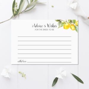 May include: A white card with the text "Advice & Wishes for the Bride-to-Be" and a watercolor illustration of lemons and leaves. The card has lines for writing and the text "with love..." at the bottom.