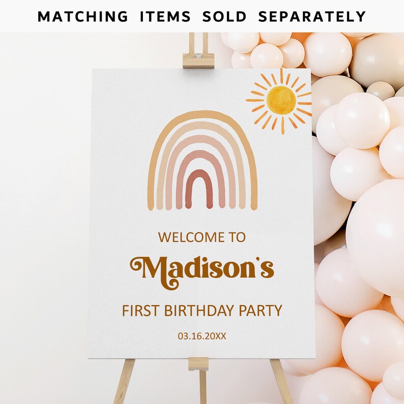 May include: A welcome sign for a first birthday party with a rainbow and sun design. The sign says "Welcome to Madison's First Birthday Party 03.16.20XX".