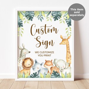 May include: A framed custom sign featuring watercolor illustrations of safari animals, including a zebra, lion, rhino, tiger, elephant, and giraffe. The sign has the text "Custom Sign" and "We Customize You Print" in brown script.