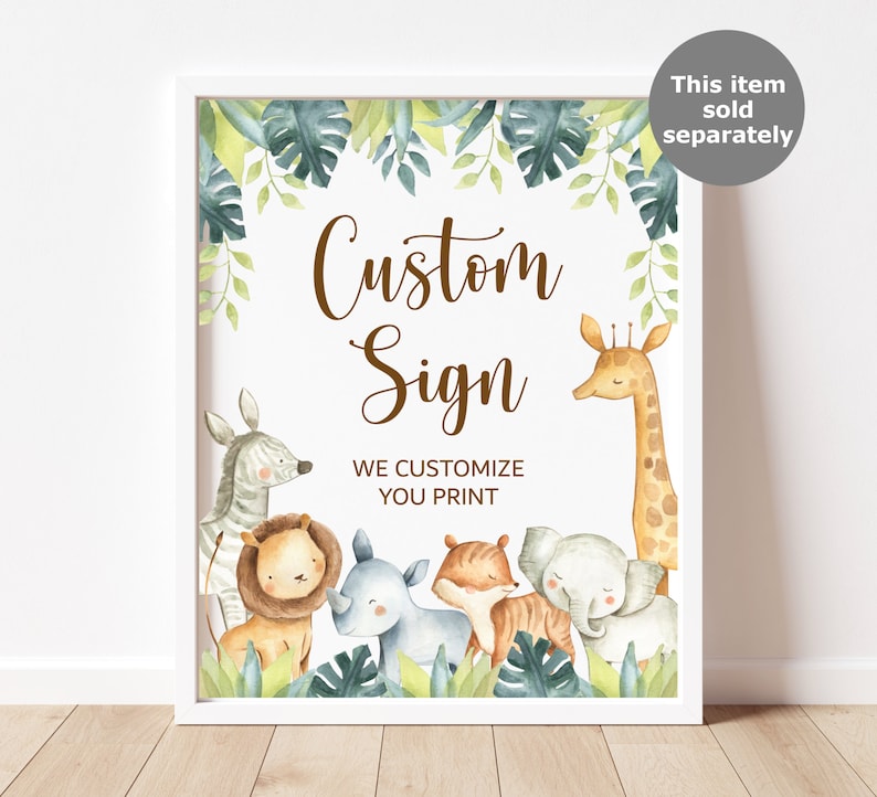 May include: A framed custom sign featuring watercolor illustrations of safari animals, including a zebra, lion, rhino, tiger, elephant, and giraffe. The sign has the text "Custom Sign" and "We Customize You Print" in brown script.