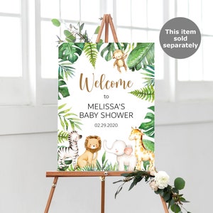 May include: Welcome to Melissa's Baby Shower sign with a jungle theme. The sign features a white background with green leaves, a monkey, a zebra, a lion, an elephant, and a giraffe. The date of the shower is 02.29.2020.