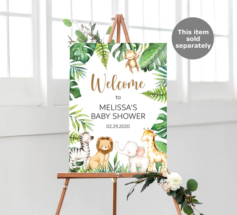 May include: Welcome to Melissa's Baby Shower sign with a jungle theme. The sign features a white background with green leaves, a monkey, a zebra, a lion, an elephant, and a giraffe. The date of the shower is 02.29.2020.
