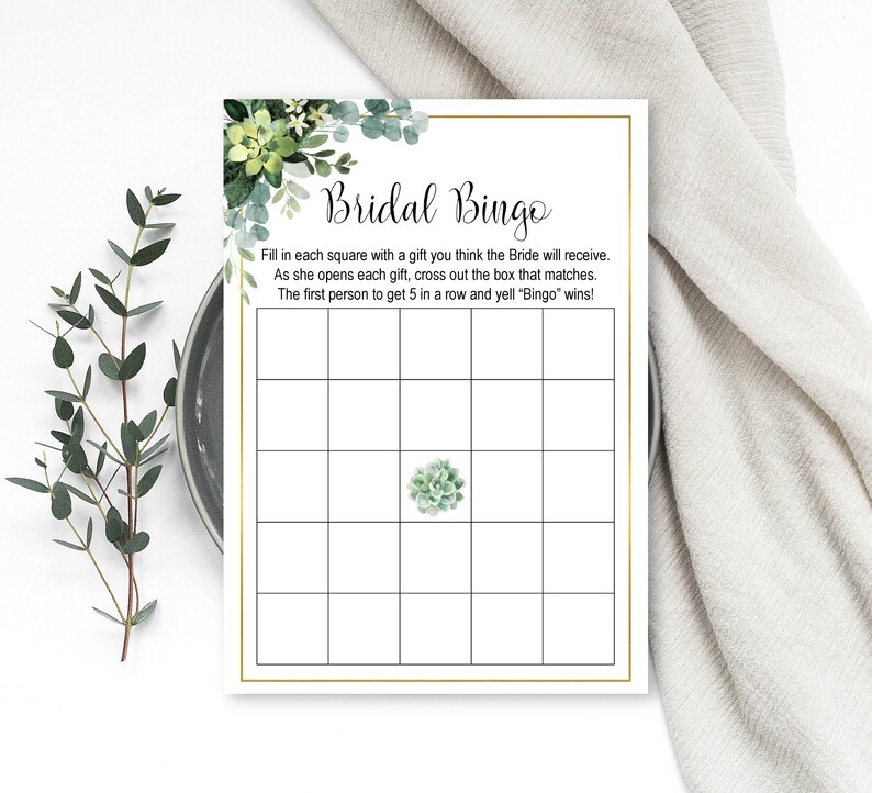 May include: A printable bridal bingo card with a green succulent illustration in the center. The text reads "Bridal Bingo" and includes instructions for playing the game.