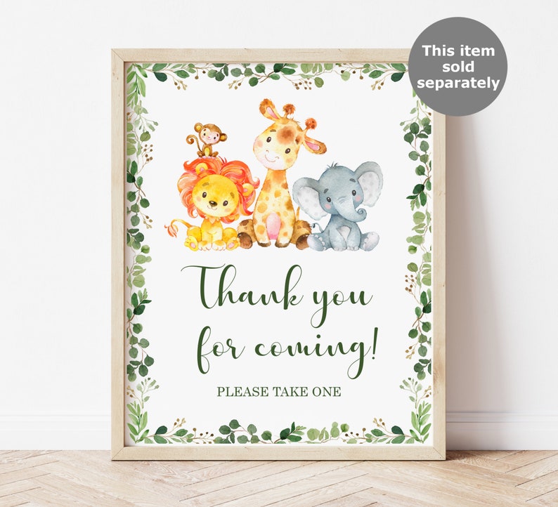 May include: A printable thank you sign with a green leafy border. The sign features a lion, giraffe, and elephant with the text "Thank you for coming! Please take one."