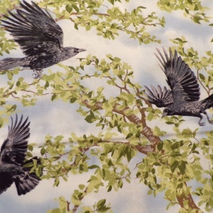 May include: A white background with a pattern of green leaves and branches. Three black crows are flying through the branches.