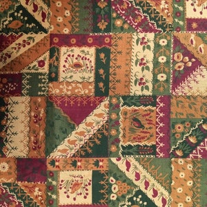 May include: A patchwork fabric with a variety of colors and patterns, including green, brown, red, and white. The fabric features a repeating pattern of small squares and rectangles, each with a different design. The fabric is perfect for quilting, sewing, or crafting.