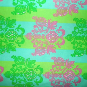 May include: A repeating pattern of green and pink floral designs on a turquoise and lime green striped background.