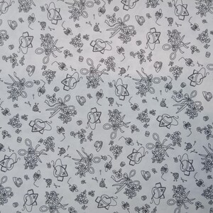 May include: A white background with a repeating pattern of black line drawings of scissors, flowers, and spools of thread.