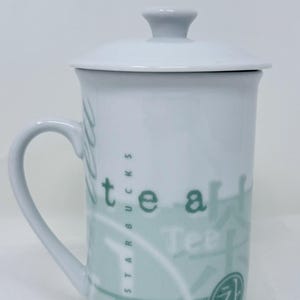 Vintage 1998 Starbucks Tea Mug with Lid – Multilingual “Tea” Design – White & Mint Green Porcelain – Rare Collector’s Mug