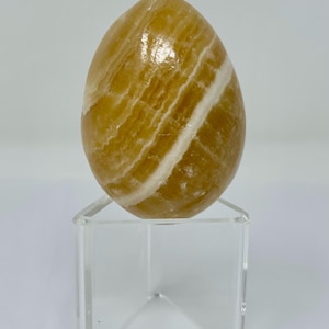 polished onyx alabaster agate stone egg tan white striped beige Easter carnelian