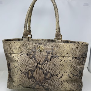 May include: A rustic wooden sign with the text "Welcome to our home" in a handwritten style. The sign features a distressed finish and a simple, inviting design, perfect for entryway decor.