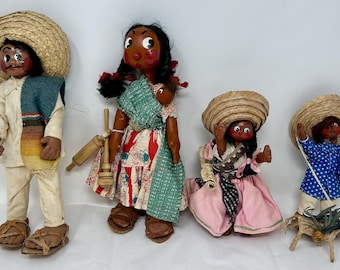 Juego vintage de 4 muñecos mexicanos de Guadalajara, de barro, con ojos grandes. Representan a una familia: niño, niña, hombre y mujer. Arte popular hecho a mano.