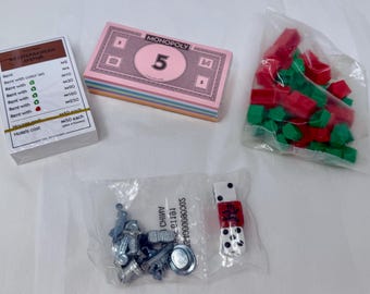 Repuestos para el juego Monopoly: dinero, cartas de escritura, casas y hoteles, fichas y dados – Hasbro
