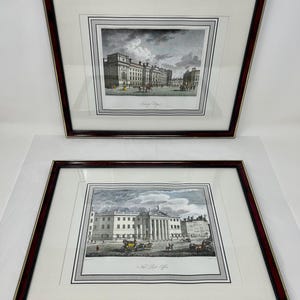 May include: Two framed black and white prints of historical buildings in London. The top print shows Somerset College and the bottom print shows the New Post Office.