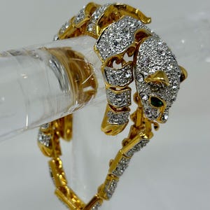 vintage costume jewelry rhinestone cat jaguar leopard panther bracelet gold tone green eyes articulated