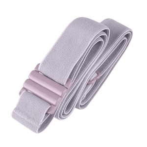 May include: A light purple elastic strap with a plastic buckle. The strap is folded and coiled.