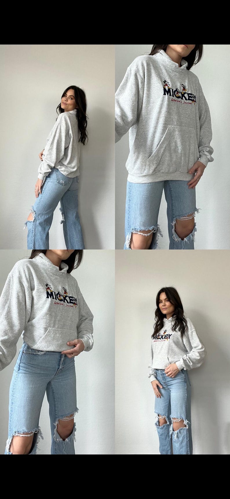 May include: A gray hooded sweatshirt with a Mickey Mouse graphic and the text "Mickey Mouse's Clubhouse" on the front. The sweatshirt is being worn by a person with long dark hair and blue jeans.
