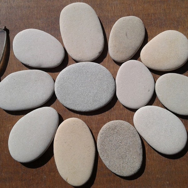 12 flat beach stones 2.2"- 2.7"[5.5-6.8cm]. Nice shapes and colors. Natural sea pebbles for various crafts and decoration.