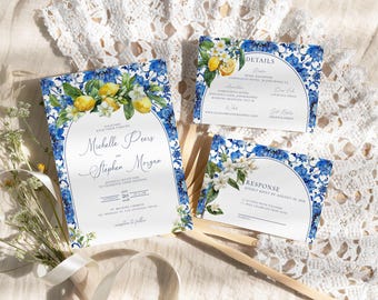 May include: A set of three wedding invitations with a blue and white floral design featuring lemons and white flowers. The invitations include details about the wedding, the response card, and the couple's names: Michelle Peers and Stephen Morgan.