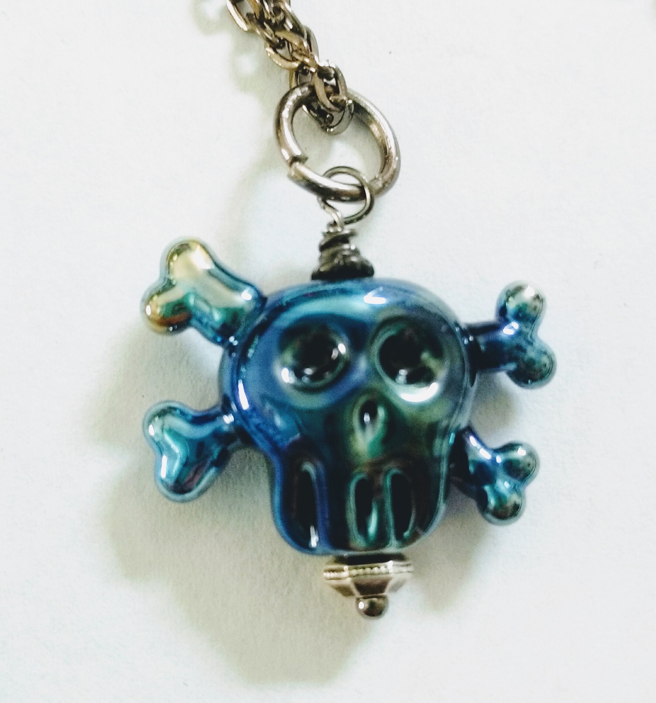 Lampwork Blue Reactive Glass Skull and Crossbones Necklace Glass Skull Necklace Handmade Bead and Gunmetal Chain Necklace Halloween Jewelry
