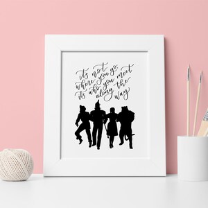 May include: Black and white silhouette print of the Wizard of Oz characters with the quote "It's not where you go, it's who you meet along the way."