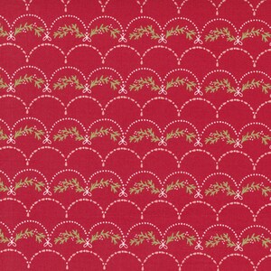 May include: Red fabric with a repeating pattern of green sprigs and white dots forming arches. The sprigs have small white dots on them.