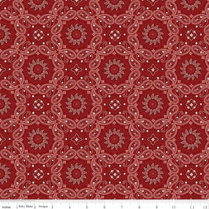 May include: Red bandana fabric with a white paisley pattern. The fabric is a repeating pattern of white paisley shapes on a red background.