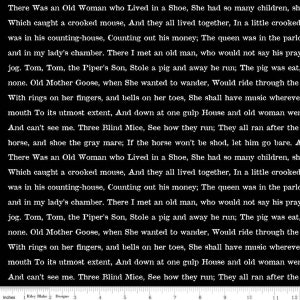 May include: Black and white text on a white background. The text is a nursery rhyme about an old woman who lived in a shoe. The text is printed on a fabric with a ruler printed at the bottom. The ruler is in inches.