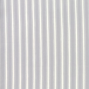 May include: A close-up of a grey and white striped fabric. The fabric has a subtle texture and a soft, muted colour palette.