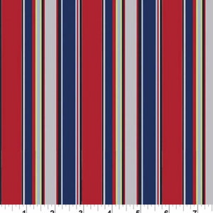 May include: Red, white, blue and yellow striped fabric with a ruler showing 17.8 cm.