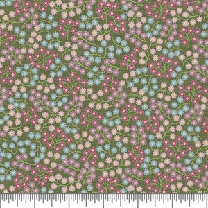 Può includere: Un tessuto verde con un motivo ripetitivo di piccoli fiori rosa, blu e viola. I fiori sono disposti in modo casuale sul tessuto.