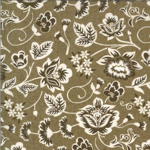 May include: A repeating floral pattern with white and brown flowers, leaves, and vines on an olive green background. The design includes various sizes and styles of flowers, creating a classic, vintage aesthetic. The fabric has a subtle, textured appearance.